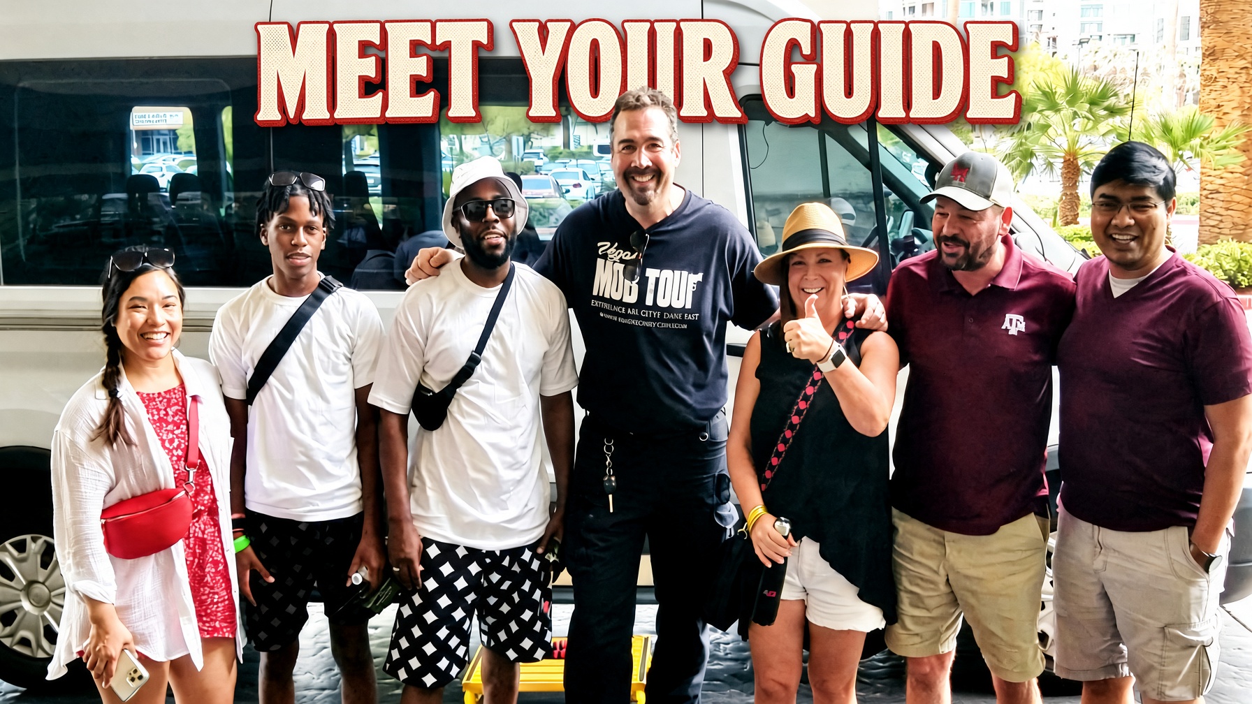 Tour guide with guests in front of the shuttle